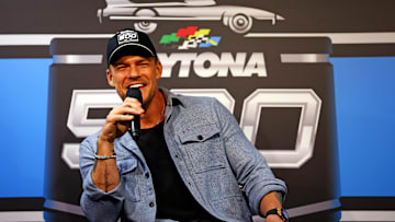 Feb 16, 2025; Daytona Beach, Florida, USA; American actor Alan Ritchson speaks during a press conference before the Daytona 500 at Daytona International Speedway. Mandatory Credit: Peter Casey-Imagn Images