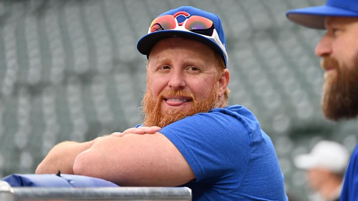May 27, 2025; Chicago, Illinois, USA; Chicago Cubs first base Justin Turner (3) smiles during warm ups prior to a game against the Colorado Rockies at Wrigley Field.