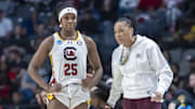 Mar 30, 2025; Birmingham, AL, USA; South Carolina Gamecocks head coach Dawn Staley works with guard Raven Johnson (25) during the first half of an Elite 8 NCAA Tournament basketball game against the Duke Blue Devils at Legacy Arena. Mandatory Credit: Vasha Hunt-Imagn Images