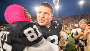 Oct 25, 2025; Nashville, Tennessee, USA;  Vanderbilt Commodores quarterback Diego Pavia (2) and wide receiver Kayleb Barnett (81) celebrate the win against the Missouri Tigers during the second half at FirstBank Stadium. Mandatory Credit: Steve Roberts-Imagn Images
