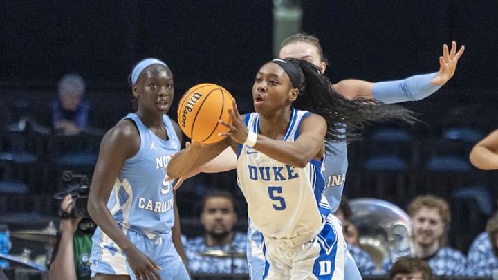 Duke Blue Devils guard Oluchi Okananwa (5) passes away from pressure during the Sweet 16 NCAA Tournament basketball game against the North Carolina Tar Heels. Duke Blue Devils guard Oluchi Okananwa (5) passes away from pressure during the Sweet 16 NCAA Tournament basketball game against the North Carolina Tar Heels.