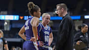 TCU Horned Frogs guards Donovyn Hunter and Hailey Van Lith talk to head coach Mark Campbell during the first half of an Elite 8.