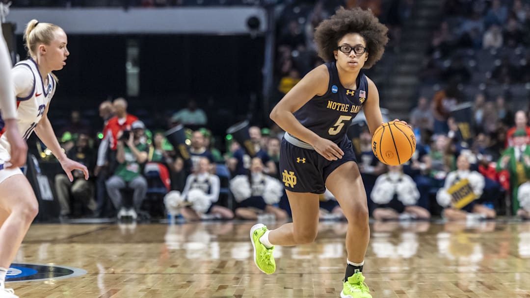 Mar 29, 2025; Birmingham, AL, USA; Notre Dame Fighting Irish guard Olivia Miles (5) works the ball down the court against the TCU Horned Frogs during the first half of a Sweet 16 NCAA Tournament basketball game at Legacy Arena. Mandatory Credit: Vasha Hunt-Imagn Images Mar 29, 2025; Birmingham, AL, USA; Notre Dame Fighting Irish guard Olivia Miles (5) works the ball down the court against the TCU Horned Frogs during the first half of a Sweet 16 NCAA Tournament basketball game at Legacy Arena. Mandatory Credit: Vasha Hunt-Imagn Images