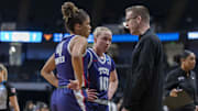 TCU Horned Frogs guards Donovyn Hunter and Hailey Van Lith talk to head coach Mark Campbell during the first half of an Elite 8 NCAA Tournament game against the Texas Longhorns at Legacy Arena. 