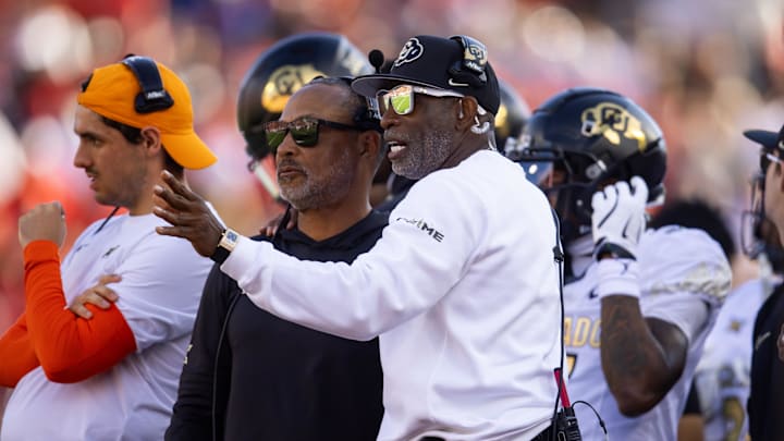 Oct 19, 2024; Tucson, Arizona, USA; Colorado Buffalos head coach Deion Sanders (right) with wide receivers coach Jason Phillips against the Arizona Wildcats at Arizona Stadium. Oct 19, 2024; Tucson, Arizona, USA; Colorado Buffalos head coach Deion Sanders (right) with wide receivers coach Jason Phillips against the Arizona Wildcats at Arizona Stadium.