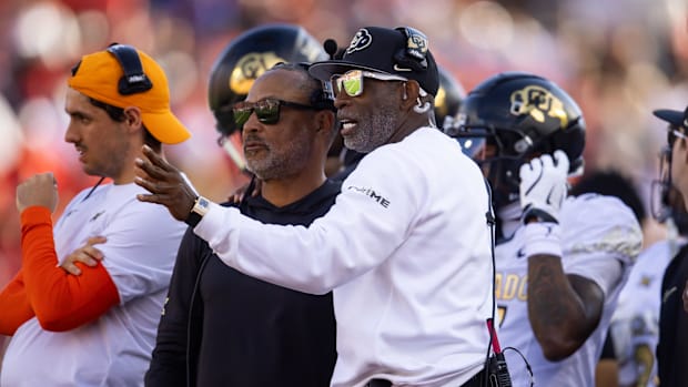Oct 19, 2024; Tucson, Arizona, USA; Colorado Buffalos head coach Deion Sanders (right) with wide receivers coach Jason Philli