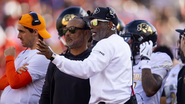 Oct 19, 2024; Tucson, Arizona, USA; Colorado Buffalos head coach Deion Sanders (right) with wide receivers coach Jason Phillips against the Arizona Wildcats at Arizona Stadium. Mandatory Credit: Mark J. Rebilas-Imagn Images Oct 19, 2024; Tucson, Arizona, USA; Colorado Buffalos head coach Deion Sanders (right) with wide receivers coach Jason Phillips against the Arizona Wildcats at Arizona Stadium. Mandatory Credit: Mark J. Rebilas-Imagn Images