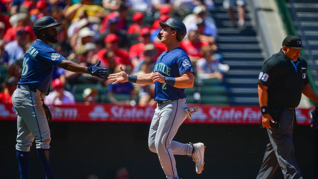 Apr 5, 2026; Anaheim, California, USA; Seattle Mariners second baseman Cole Young (2) is greeted by left fielder Randy Arozarena (56) after both score runs against the Los Angeles Angels during the second inning at Angel Stadium. Mandatory Credit: Gary A. Vasquez-Imagn Images Apr 5, 2026; Anaheim, California, USA; Seattle Mariners second baseman Cole Young (2) is greeted by left fielder Randy Arozarena (56) after both score runs against the Los Angeles Angels during the second inning at Angel Stadium. Mandatory Credit: Gary A. Vasquez-Imagn Images