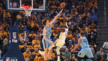 Apr 15, 2025; San Francisco, California, USA; Golden State Warriors forward Jimmy Butler III (10) shoots over Memphis Grizzlies center Zach Edey (14) in the second quarter at the Chase Center. Mandatory Credit: Cary Edmondson-Imagn Images