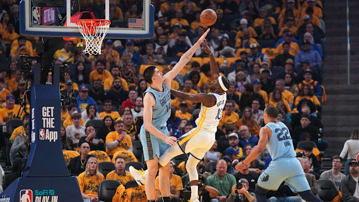 Apr 15, 2025; San Francisco, California, USA; Golden State Warriors forward Jimmy Butler III (10) shoots over Memphis Grizzlies center Zach Edey (14) in the second quarter at the Chase Center. Mandatory Credit: Cary Edmondson-Imagn Images