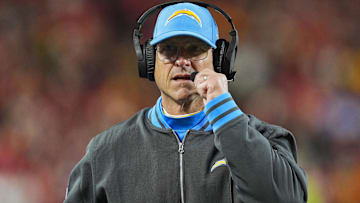 Los Angeles Chargers head coach Jim Harbaugh looks on during the first half against the Kansas City Chiefs at GEHA Field at Arrowhead Stadium.