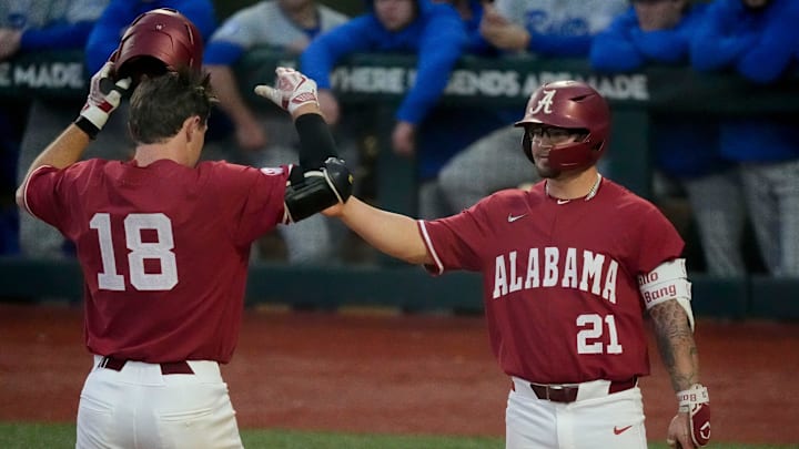 Feb 18, 2025; Tuscaloosa, Alabama, USA; Alabama hitter Will Hodo is congratulated at home plate by Brennen Norton after Hodo hit a solo home run against Middle Tennesse State at Sewell-Thomas Stadium.