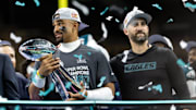 Philadelphia Eagles quarterback Jalen Hurts and head coach Nick Sirianni celebrate with the Vince Lombardi Trophy.