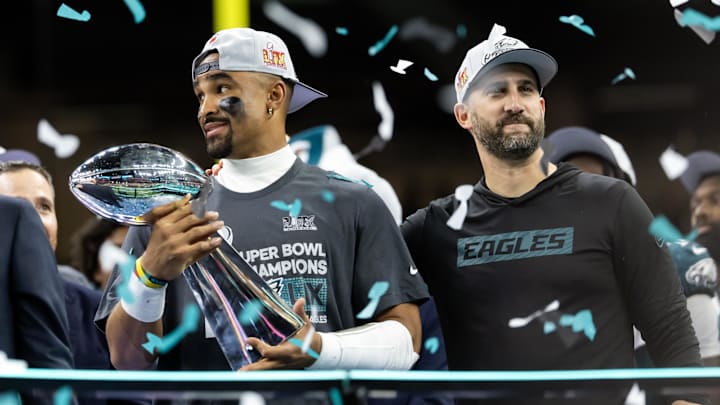Philadelphia Eagles quarterback Jalen Hurts and head coach Nick Sirianni celebrate with the Vince Lombardi Trophy.