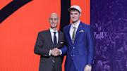 Jun 25, 2025; Brooklyn, NY, USA;  Liam McNeeley stands with NBA commissioner Adam Silver after being selected as the 29th pick by the Phoenix Suns in the first round of the 2025 NBA Draft at Barclays Center. Mandatory Credit: Brad Penner-Imagn Images