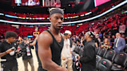 Jan 19, 2025; Miami, Florida, USA;  Miami Heat forward Jimmy Butler (22) walks off the court after greeting court-side friends following the victory over the San Antonio Spurs at Kaseya Center. Mandatory Credit: Jim Rassol-Imagn Images