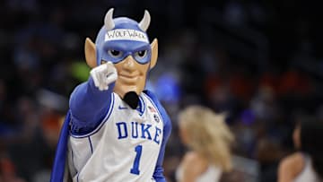 Mar 14, 2024; Washington, D.C., USA; The Duke basketball mascot Blue Devil dances on the court during a timeout against the North Carolina State Wolfpack at Capital One Arena. Mandatory Credit: Geoff Burke-Imagn Images