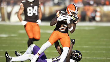 Oct 27, 2024; Cleveland, Ohio, USA; Cleveland Browns wide receiver Elijah Moore (8) makes a catch for a first down under coverage by Baltimore Ravens cornerback Brandon Stephens (21) during the fourth quarter at Huntington Bank Field. Mandatory Credit: Scott Galvin-Imagn Images