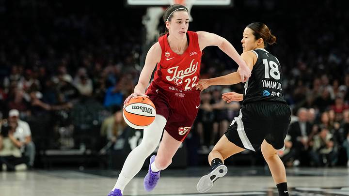 Oct 1, 2026; Las Vegas, Nevada, USA;  Indiana Fever guard Caitlin Clark (22) dribbles the ball against Las Vegas Aces guard Mai Yamamoto (18) during the first quarter of game three of the first round for the 2026 WNBA Playoffs at Michelob Ultra Arena.  Mandatory Credit: Lucas Peltier-Imagn Images