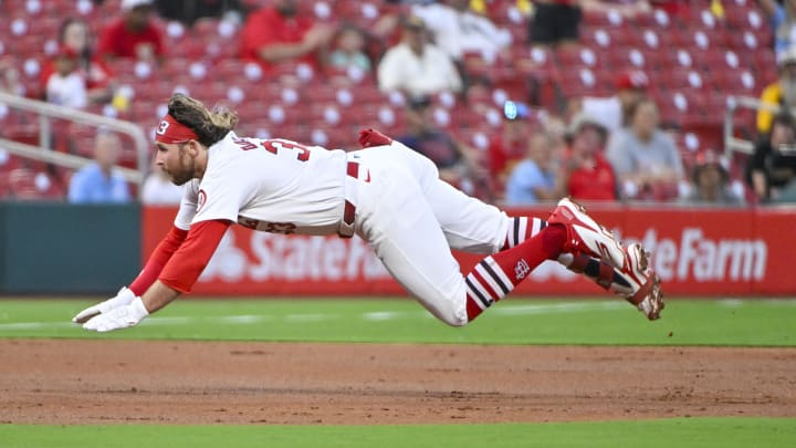 Aug 26, 2024; St. Louis, Missouri, USA;  St. Louis Cardinals second baseman Brendan Donovan (33) slides in at third for a triple against the San Diego Padres during the second inning at Busch Stadium. Mandatory Credit: Jeff Curry-USA TODAY Sports