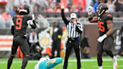 Oct 19, 2025; Cleveland, Ohio, USA; Cleveland Browns safety Grant Delpit (9) and defensive end Myles Garrett (95) celebrates after Delpit sacked Miami Dolphins quarterback Tua Tagovailoa (1) during the first half at Huntington Bank Field. Mandatory Credit: Ken Blaze-Imagn Images