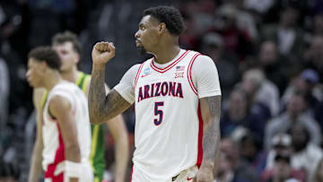 Mar 23, 2025; Seattle, WA, USA;  Arizona Wildcats guard KJ Lewis (5) fist pumps against the Oregon Ducks in the first half at Climate Pledge Arena. Mandatory Credit: Stephen Brashear-Imagn Images