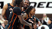 Oklahoma State's Khalil Brantley (5) celebrates with a teammates during the college basketball game between the Oklahoma State University Cowboys and the Southern Illinois Salukis, Thursday, Nov. 14, 2024.