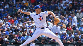 May 26, 2025; Chicago, Illinois, USA; Chicago Cubs starting pitcher Jameson Taillon (50) pitches during the first inning against the Colorado Rockies at Wrigley Field. 