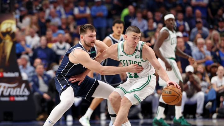 Jun 12, 2024; Dallas, Texas, USA; Boston Celtics guard Payton Pritchard (11) dribbles the ball against Dallas Mavericks guard Luka Doncic (77) during the fourth quarter during game three of the 2024 NBA Finals at American Airlines Center. Mandatory Credit: Kevin Jairaj-USA TODAY Sports
