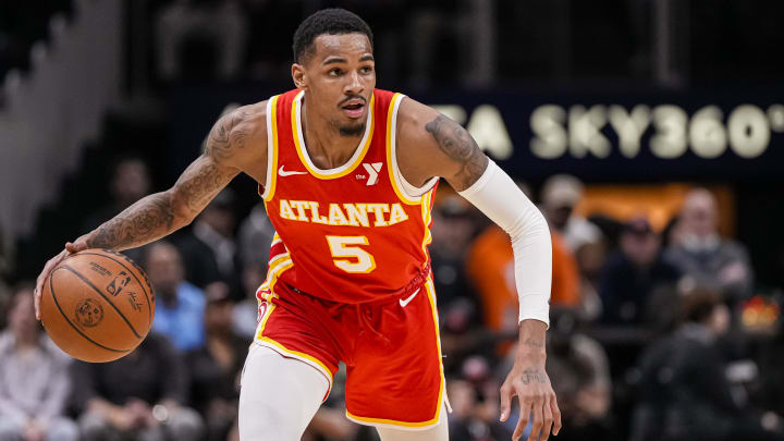 Mar 10, 2024; Atlanta, Georgia, USA; Atlanta Hawks guard Dejounte Murray (5) controls the ball against the New Orleans Pelicans during the first half at State Farm Arena.