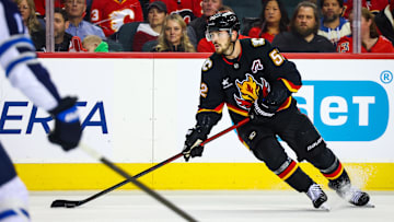 Oct 26, 2024; Calgary, Alberta, CAN; Calgary Flames defenseman MacKenzie Weegar (52) controls the puck against the Winnipeg Jets during the second period at Scotiabank Saddledome. Mandatory Credit: Sergei Belski-Imagn Images