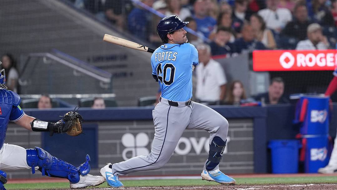 Jul 21, 2026; Toronto, Ontario, CAN; Tampa Bay Rays catcher Nick Fortes (40) hits a three run home run against the Toronto Blue Jays during the fifth inning at Rogers Centre. Mandatory Credit: Nick Turchiaro-Imagn Images
