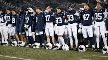 Penn State Nittany Lion players sing their alma mater