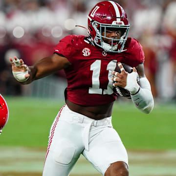 Sep 28, 2024; Tuscaloosa, Alabama, USA;  Alabama Crimson Tide linebacker Jihaad Campbell (11) returns an interception against Georgia Bulldogs wide receiver Dillon Bell (86) during the first half at Bryant-Denny Stadium. Mandatory Credit: John David Mercer-Imagn Images