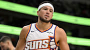 Nov 12, 2025; Dallas, Texas, USA; Phoenix Suns guard Devin Booker (1) reacts to making a basket against the Dallas Mavericks during the second half at the American Airlines Center. Mandatory Credit: Jerome Miron-Imagn Images