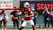 Sep 6, 2025; Raleigh, North Carolina, USA; North Carolina State Wolfpack quarterback CJ Bailey (11) prepares to throw the football during the first half of the game against Virginia Cavaliers at Carter-Finley Stadium. Mandatory Credit: Jaylynn Nash-Imagn Images