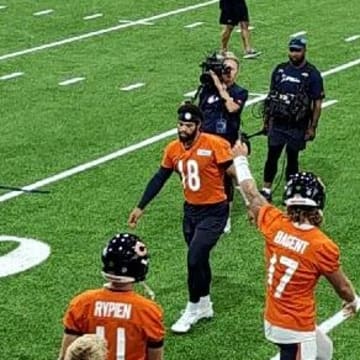 Caleb Williams and QBs got through Monday's stretching at the Walter Payton Center after rain forced practice indoors.