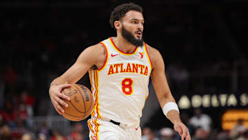 Oct 14, 2024; Atlanta, Georgia, USA; Atlanta Hawks forward David Roddy (8) dribbles against the Philadelphia 76ers in the fourth quarter at State Farm Arena.