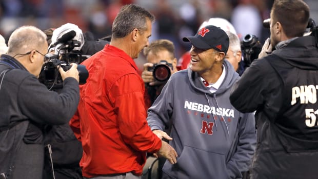 Nebraska Cornhuskers head coach Mike Riley and Ohio State Buckeyes head coach Urban Meyer