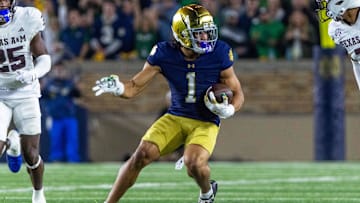 Sep 13, 2025; South Bend, Indiana, USA; Notre Dame Fighting Irish wide receiver Jaden Greathouse (1) runs with the ball during the second half against the Texas A&M Aggies at Notre Dame Stadium. Mandatory Credit: Michael Caterina-Imagn Images