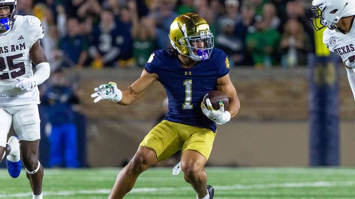 Sep 13, 2025; South Bend, Indiana, USA; Notre Dame Fighting Irish wide receiver Jaden Greathouse (1) runs with the ball during the second half against the Texas A&M Aggies at Notre Dame Stadium. Mandatory Credit: Michael Caterina-Imagn Images