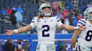 Kansas State quarterback Avery Johnson celebrates the Wildcats' dominating win over in-state rival Kansas on Saturday.