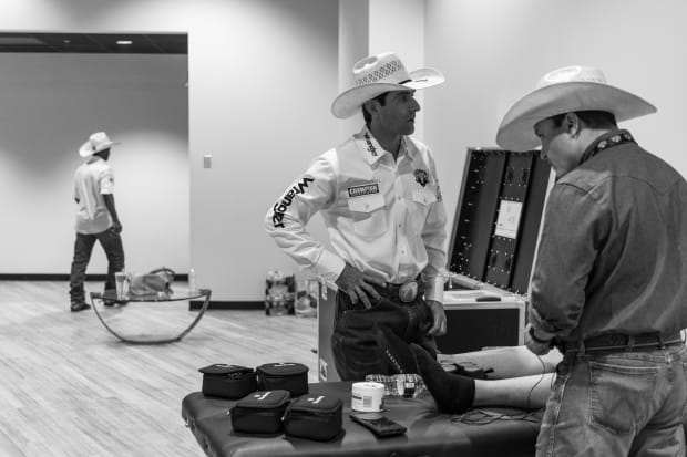 Three cowboys in a room