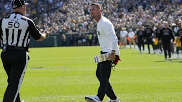 Sep 29, 2024; Green Bay, Wisconsin, USA;  Green Bay Packers head coach Matt LaFleur argues a call on a muffed punt with field judge Aaron Santi (50) during the second quarter of their game against the Minnesota Vikings Sunday, September 29, 2024 at Lambeau Field in Green Bay, Wisconsin. Mandatory Credit: Mark Hoffman/USA TODAY Network via Imagn Images