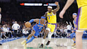 Apr 8, 2025; Oklahoma City, Oklahoma, USA; Oklahoma City Thunder guard Shai Gilgeous-Alexander (2) drives around Los Angeles Lakers forward Jarred Vanderbilt (2) during the second half at Paycom Center. Mandatory Credit: Alonzo Adams-Imagn Images