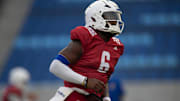 Kansas redshirt senior quarterback Jalon Daniels (6) runs to position during their first practice inside David Booth Kansas Memorial Stadium on Aug. 1, 2025.