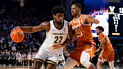 Texas Longhorns forward Jayson Kent (25) guards Vanderbilt Commodores forward Jaylen Carey (22) during the first half at Memorial Gymnasium. 