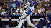 Sep 19, 2024; Miami, Florida, USA; Los Angeles Dodgers designated hitter Shohei Ohtani (17) hits a two-run home run against the Miami Marlins during the sixth inning at loanDepot Park. Mandatory Credit: Sam Navarro-Imagn Images