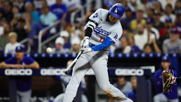 Sep 19, 2024; Miami, Florida, USA; Los Angeles Dodgers designated hitter Shohei Ohtani (17) hits a two-run home run against the Miami Marlins during the sixth inning at loanDepot Park. Mandatory Credit: Sam Navarro-Imagn Images