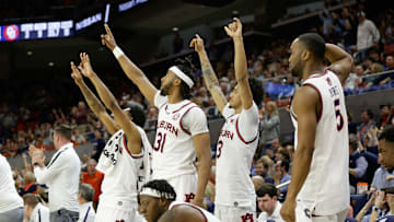 Auburn basketball players enjoy what the Jungle does before every home game at the Neville Arena